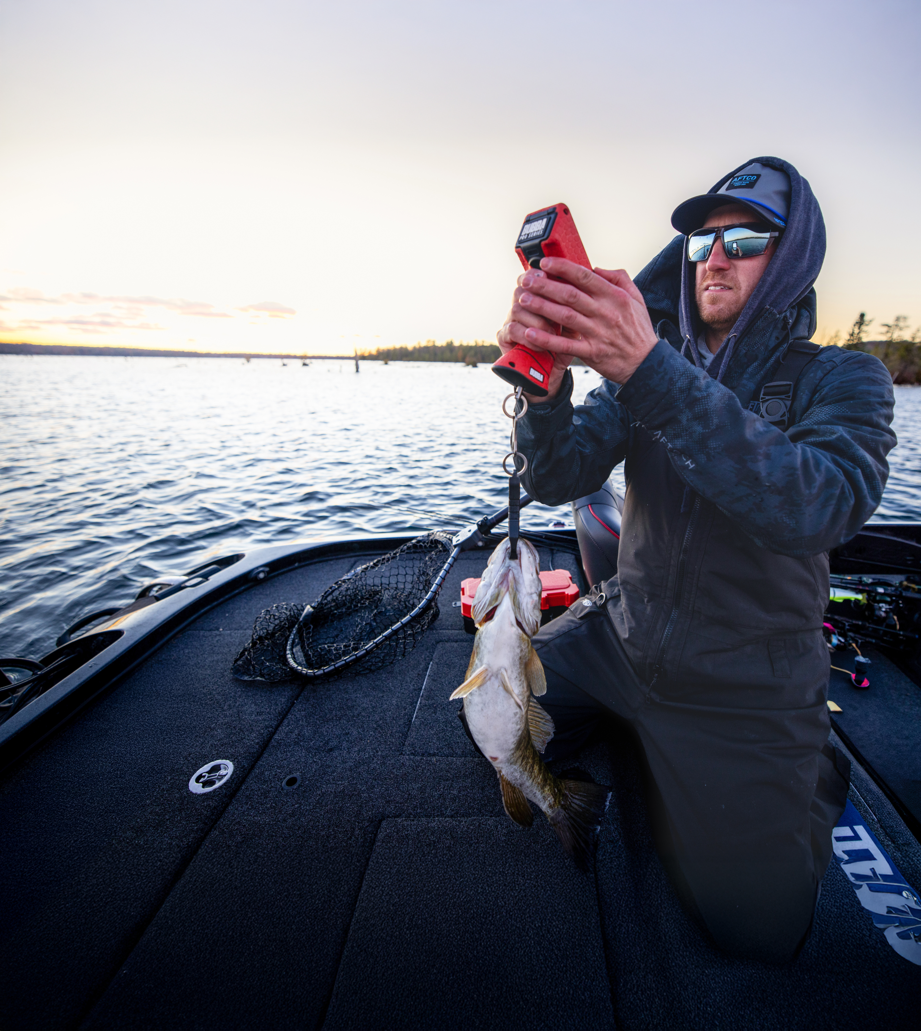 Anglers weighing a fish during MLF competition